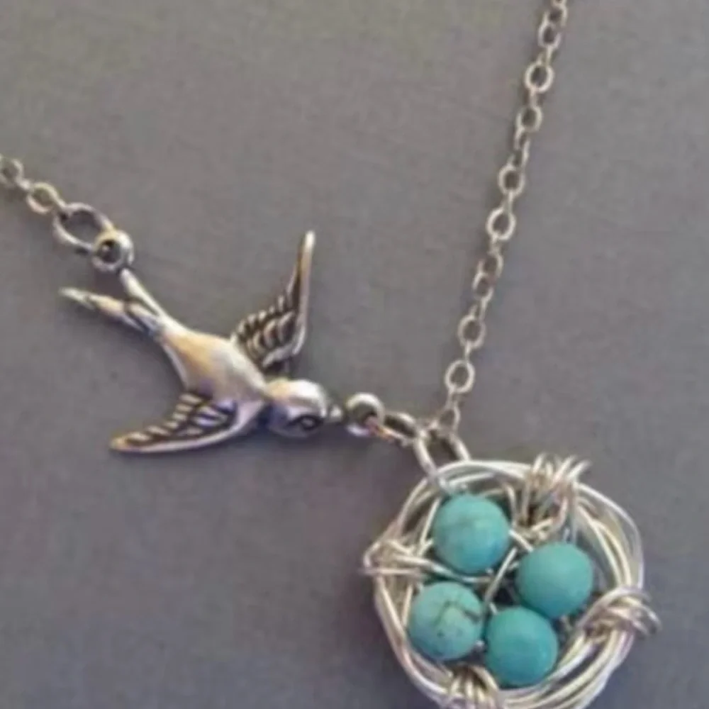 Charming Silver Bird Necklace with Turquoise Accents
